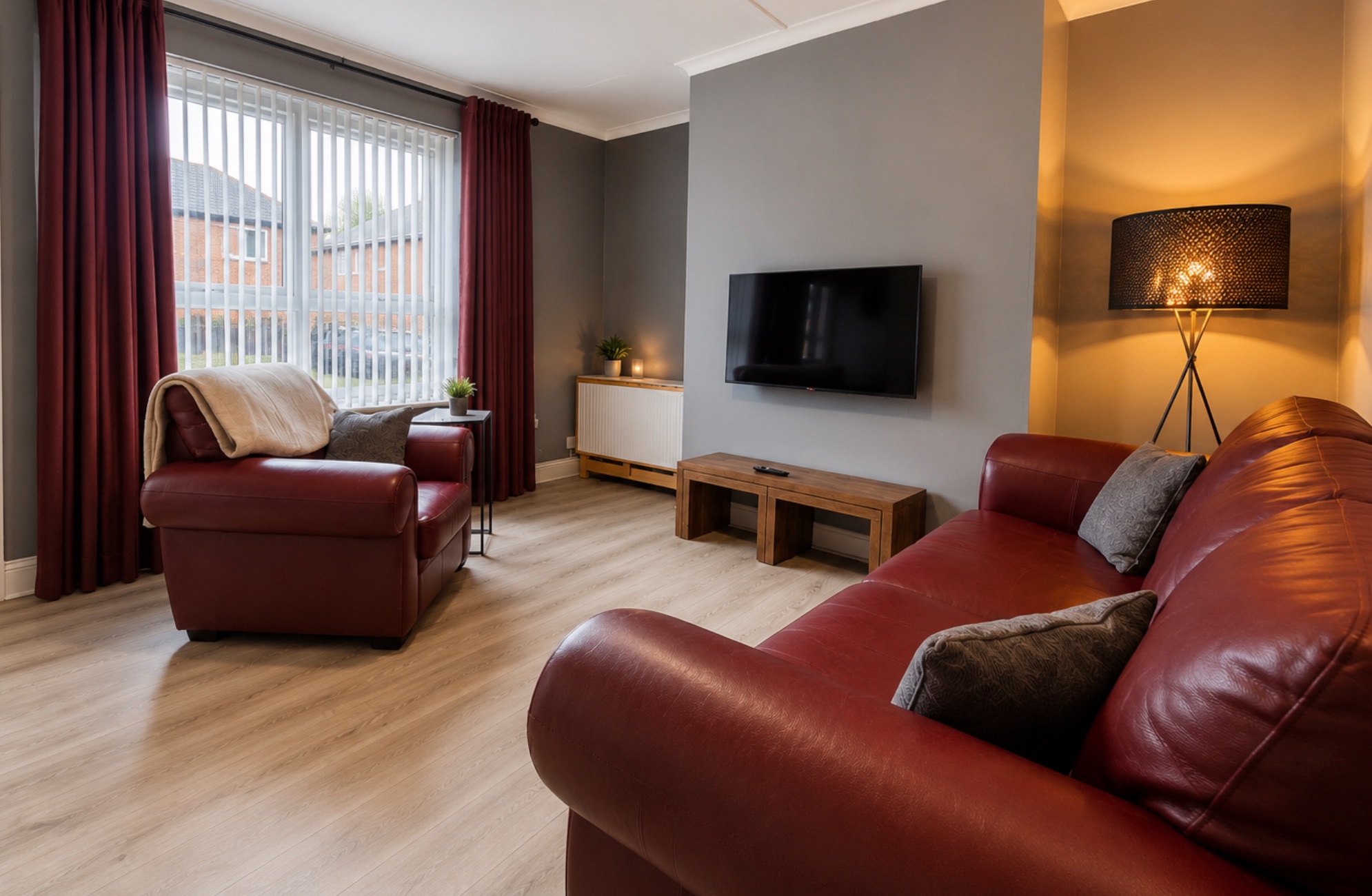 The living room at Wor Canny Hyem with the lamps on